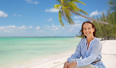 Image showing happy woman over tropical beach background