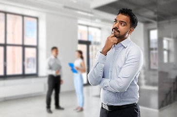 Image showing indian businessman or realtor in empty office room