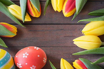 Image showing close up of colored easter eggs and tulip flowers