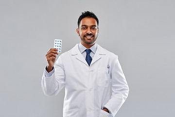 Image showing indian male doctor or pharmacist with pills