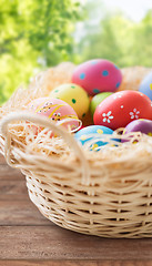 Image showing close up of colored easter eggs in basket