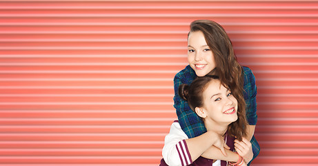 Image showing happy smiling teenage girls or friends hugging