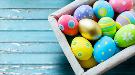 Image showing close up of colored easter eggs in basket