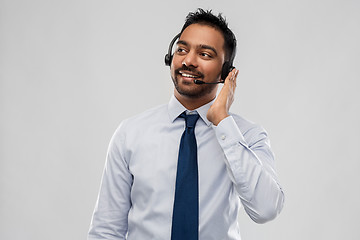 Image showing indian businessman or helpline operator in headset