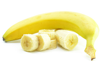 Image showing Ripe yellow banana with sliced bananas