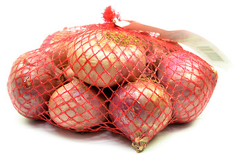 Image showing Pack of red onions isolated