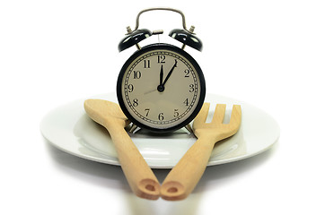 Image showing Alarm clock with fork and knife on the plate