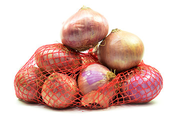 Image showing Pack of red onions isolated