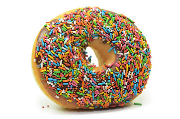 Image showing Sweet donut with rainbow candy sprinkles