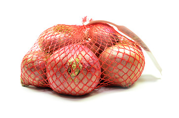 Image showing Pack of red onions isolated