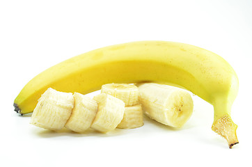 Image showing Ripe yellow banana with sliced bananas