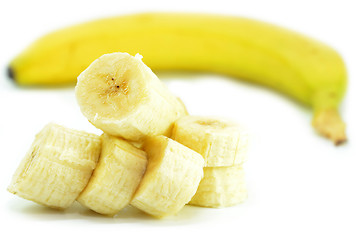 Image showing Ripe yellow banana with sliced bananas