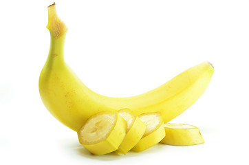 Image showing Ripe yellow banana with sliced bananas