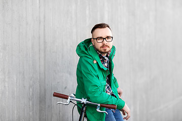 Image showing happy young hipster man with fixed gear bike