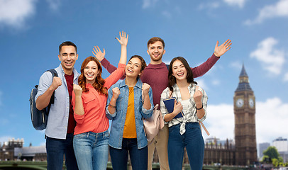 Image showing happy students celebrating success over london