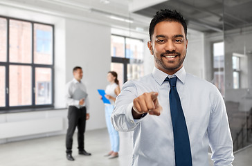 Image showing businessman pointing to you over people in office