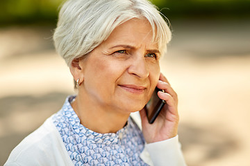 Image showing close up of senior woman calling on smartphone