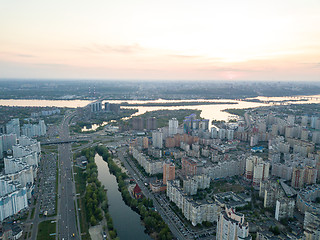 Image showing Aerial view city Kiev and the Dnieper river at sunset. Ukraine. Photo from the drone