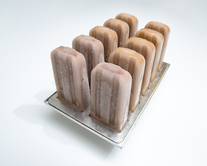 Image showing Ice cream lolly coffee in plastic molds on a white background wi