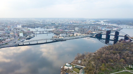 Image showing Aerial view of the Kiev (Kyiv) city, Ukraine. Dnieper river with bridges. Obolon district in the background