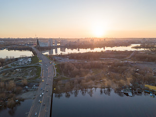 Image showing North bridge over the Dnieper River overlooking the Skaimol shopping center and Obolon district on the sunset