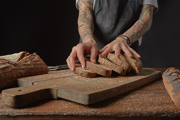 Image showing Baker Holds Bran Bread