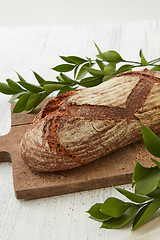 Image showing Homemade fresh bread with leaves