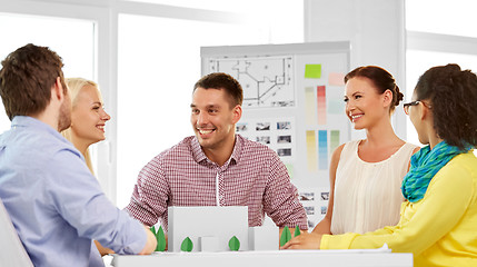 Image showing creative team with blueprint working at office