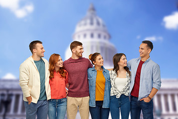 Image showing group of smiling friends over capitol building