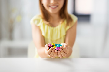 Image showing close up of girl holding chocolate easter eggs