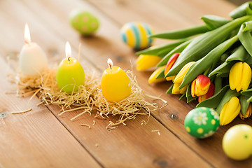 Image showing candles in shape of easter eggs and tulip flowers