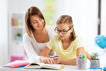 Image showing mother and daughter doing homework together