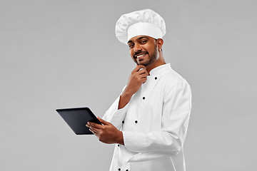 Image showing happy male indian chef with tablet computer
