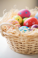 Image showing close up of colored easter eggs in basket