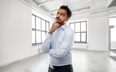 Image showing indian businessman or realtor in empty office room