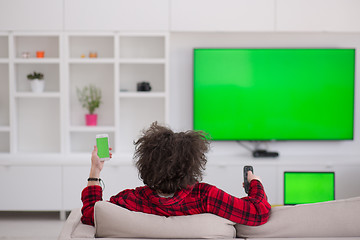 Image showing young man in bathrobe enjoying free time