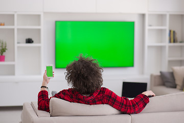 Image showing young man in bathrobe enjoying free time