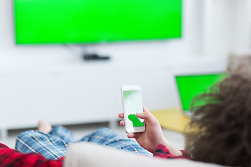 Image showing young man in bathrobe enjoying free time