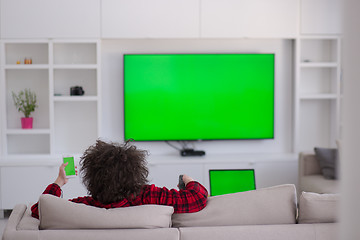 Image showing young man in bathrobe enjoying free time