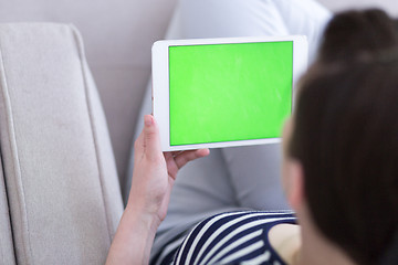 Image showing woman on sofa using tablet computer