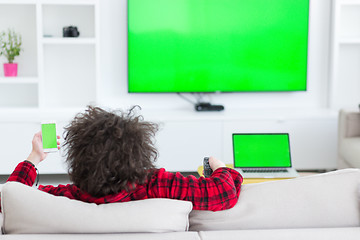 Image showing young man in bathrobe enjoying free time