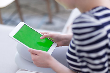 Image showing woman on sofa using tablet computer