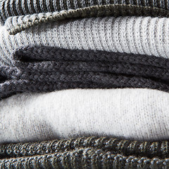 Image showing stack of warm winter knitted sweaters