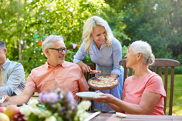 Image showing happy family having dinner or summer garden party