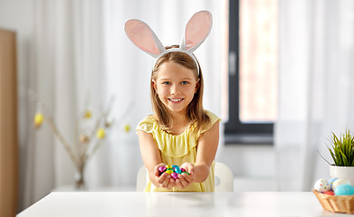 Image showing happy girl with chocolate easter eggs at home