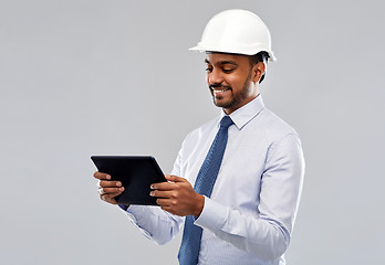 Image showing architect or businessman in helmet with tablet pc