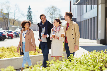 Image showing office workers with coffee on city street