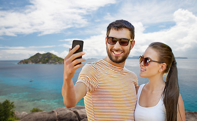 Image showing couple taking selfie by smartphone on seychelles