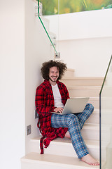 Image showing freelancer in bathrobe working from home