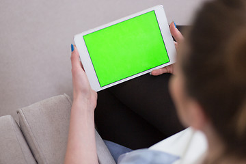 Image showing woman on sofa using tablet computer